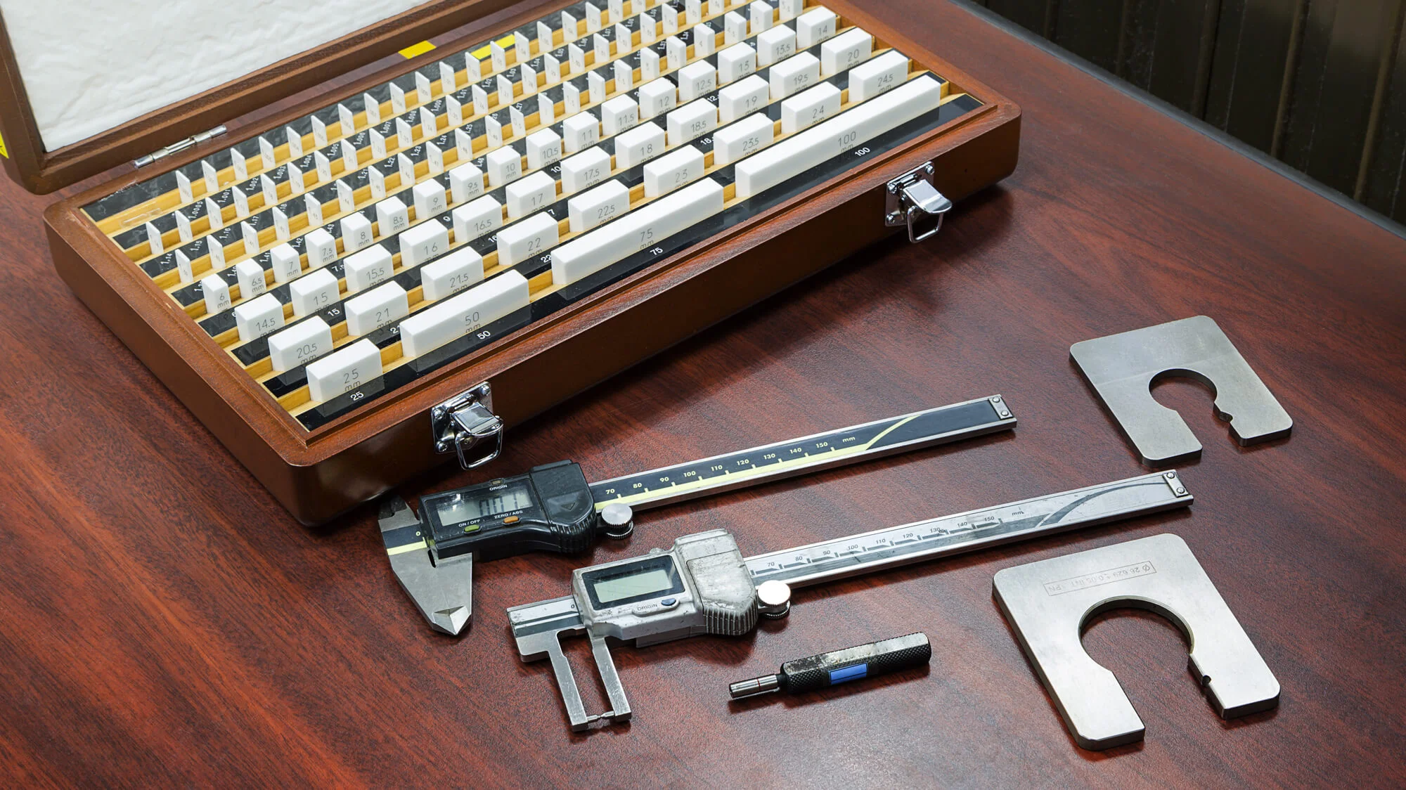 calipers and other calibration equipment on table